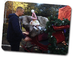 Young child on Santa's sled